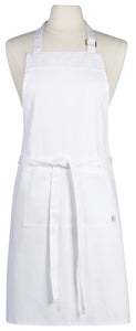 Now Designs White Chef Apron. Adjustable neck strap with extra long ties. Front pocket, unisex. 100% Cotton, machine wash and dry.