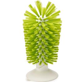 In sink brush by Joseph Joseph features sturdy curved bristles for cleaning mugs, glassware and jars. Suction cup base holds firmly to sink, easy release tab. 